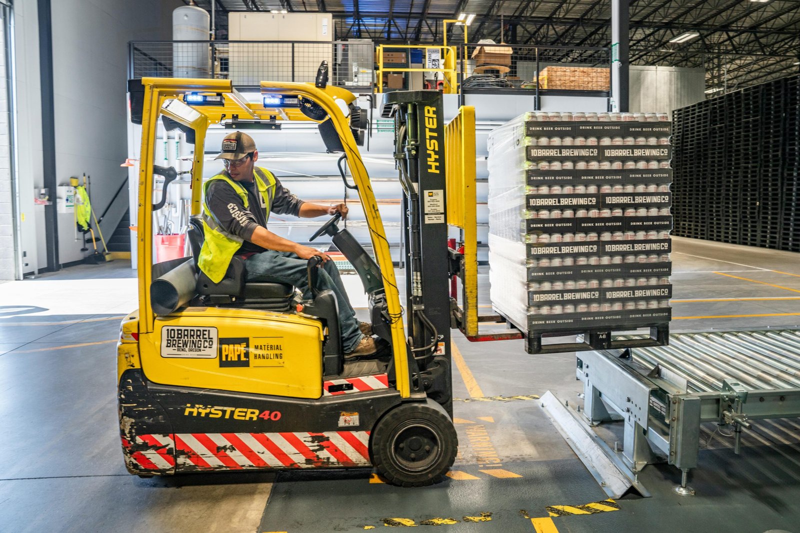 Manufacturing plant floor with machinery in operation, representing efficiency.